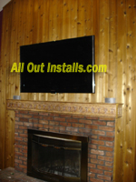 AllOutInstalls.com Flat Screen TV mounted above Fireplace